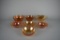 Lot of Seven Small Marigold Carnival Glass Bowls of Various Patterns & Makers