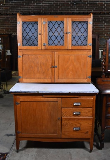 Early 20th C. Wilson Oak Kitchen Hoosier Cabinet Hoosier with Mullion Doors and Caster Feet