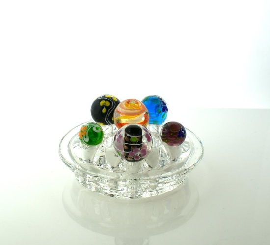 Lot of Six Art Glass Marbles Displayed on Glass Floral Frog