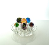 Lot of Six Art Glass Marbles Displayed on Glass Floral Frog