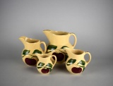 Lot of Four Graduated Watt Pottery's Hand-Painted Apple Pattern Pitchers, USA