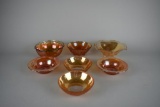 Lot of Seven Small Marigold Carnival Glass Bowls of Various Patterns & Makers