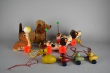 Collection of Four Fisher Price Vintage Pull Toys Plus One Battery Powered Mechanical Dog