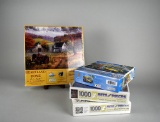 Lot of Four Unopened 1000 Piece Jigsaw Puzzles: “Heartland Home”, “Childhood Dreams”, & Others