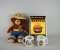 Lot of Smokey the Bear Items: Plush Toy, Two Glass Mugs, & Porcelain Ande Rooney Sign
