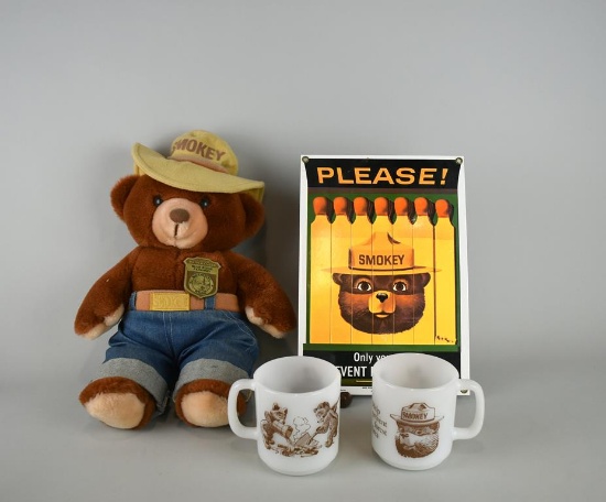 Lot of Smokey the Bear Items: Plush Toy, Two Glass Mugs, & Porcelain Ande Rooney Sign