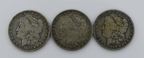 Three Circulated Morgan Silver Dollars—1883, 1884, & 1888-O