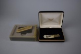 Lot of 2 Scrimshaw Style Collectibles: Gerber Belt Buckle & Japan Collector's Series Lockback Knife