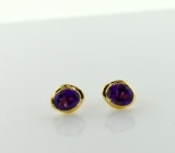 Pair of 14K Gold and Oval Cut Amethyst Solitaire Earrings