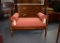 Vintage Red Upholstered Carved Mahogany Bench with Grill Work Metal Side Insets