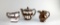 Lot of Three Copper Lusterware Pieces: Teapot & Creamers