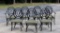 Set of Seven Black Metal Frame Dining Chairs with Green Upholstered Seats