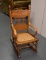 Antique Pressed Oak Child's Rocker with Caned Seat
