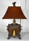 Antiqued Brass Finish Table Lamp with Rust Color Shade