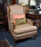 Vintage Wingback Armchair with Tan Upholstery and Accent Pillows