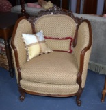 Antique Victorian Carved Walnut Club Chair with Tan Upholstery and Accent Pillows