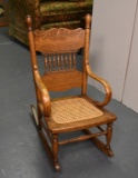 Antique Pressed Oak Child's Rocker with Caned Seat