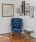 Contemporary Tufted Blue Leather Wing Chair with Brass Nailhead Trim and Caster Feet