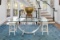 Pair of White Painted Dowel-Jointed French Stools with Saddle Seats