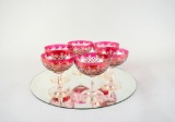 Six Cranberry Flashed Cut Glass Champagne Stems on Round Mirror Base