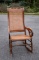 Vintage Carved Crest Rail Caned Rocking Chair