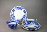Lot of Seven Antique Flow Blue Dishes: Five W H Gridley Plates, R&M Co Cup, & Other Creamer