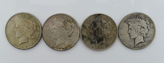 Four 1922 Peace Silver Dollars