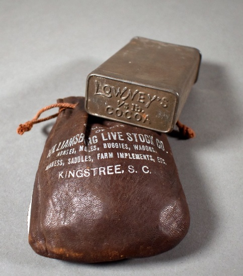 About 510 Wheat Pennies in Kingstree Live Stock Co. Leather Bag and Old Lowney's Cocoa Tin