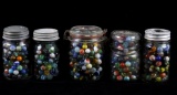 Collection of Assorted Marbles in Jars