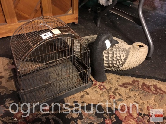 Vintage old metal bird cage and wooden swan