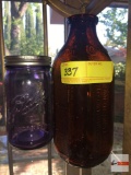 Carnation brown glass milk bottle 8.5