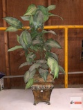 Artificial greenery plant in metal planter pot