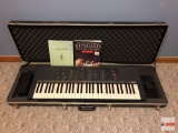 Yamaha Keyboard PSR-70 with storage/carry case and music