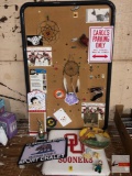 Bulletin board with misc. 49er ticket stubs etc., Sooners seat pad, Bahama's plate, magnets etc.