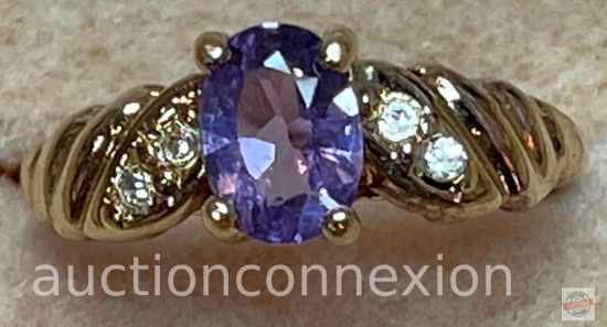 Jewelry - Quality Fashion Ring, lg. oval purple center stone w/4 sm. clear stones, sz5