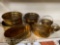 7 Brass items - bowls, baskets, some heavy, 1 w/lion handles, around 4