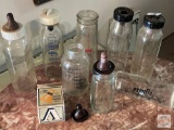Baby items - 8 vintage glass baby bottles, nipples and caps and Davol brand Nipple box