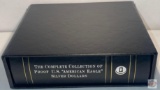 Binder in case with silver dollar coin holders and historical narrative