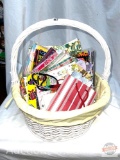 Basket with wrapping paper and small gift bags