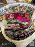 Basket with wrapping paper and gift bags