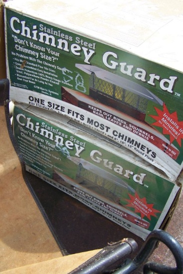 2 STAINLESS STEEL CHIMNEY GUARDS, FIREWOOD RACK, BOX OF COTTAGE GARDEN BORD