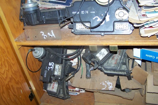 SHELF FULL OF MISC BOOKS FOR CHRYSLER AND ELECTRONIC MODULES