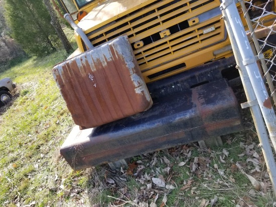 2 FUEL TANKS AND BARREL FULL OF TIRES AND WHEELS