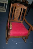 RED WOODEN ROCKING CHAIR