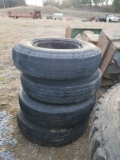 10.00-20 TIRES AND RIMS (4)