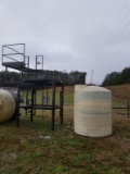 INDUSTRIAL TANK AND STEEL STAND, 1000 GAL TANK, APPROX 15' TALL STAND