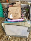 PINK TOTE OF HORSE TACK: HALTERS, STIRRUPS, AND MORE AND 3 SADDLE PADS