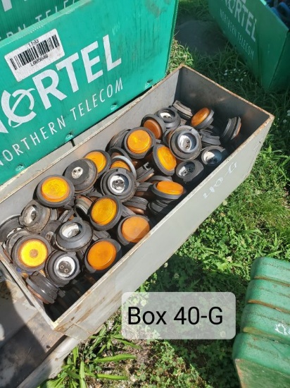 FILING CABINET DRAWER OF ORANGE ROUND LIGHTS