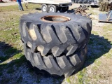 TRACTOR TIRES WITH RIMS PULLED OFF OF A NEW HOLLAND
