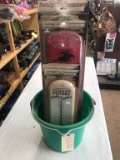 GREEN BUCKET WITH THERMOMETERS